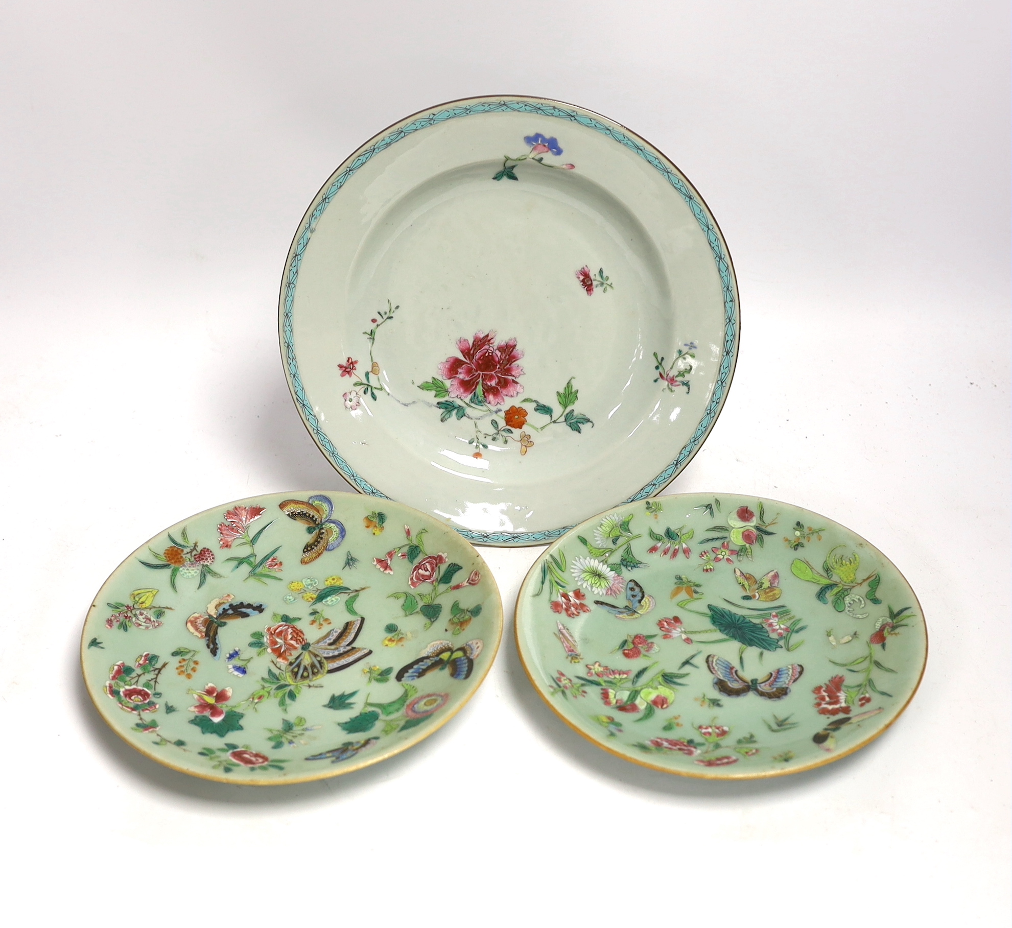 An 18th century Chinese export famille rose plate, 23cm diameter, and two 19th century celadon famille rose plates